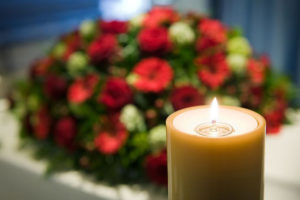 funeral ceremony flowers and candle